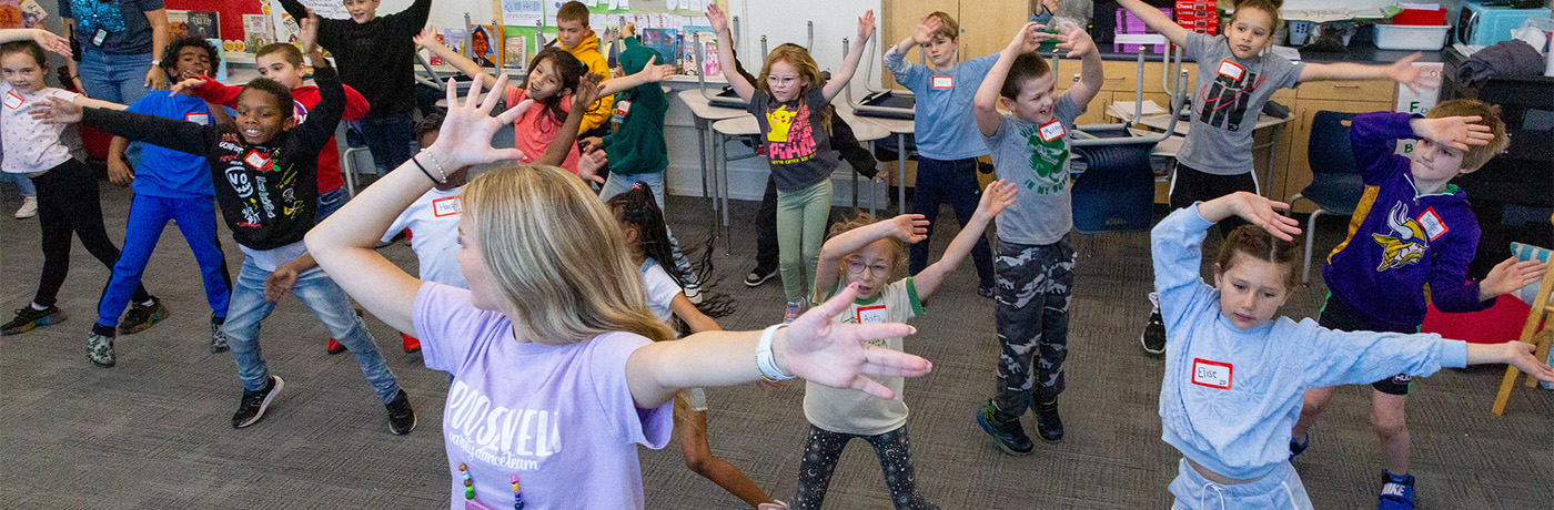 Teacher dancing with students